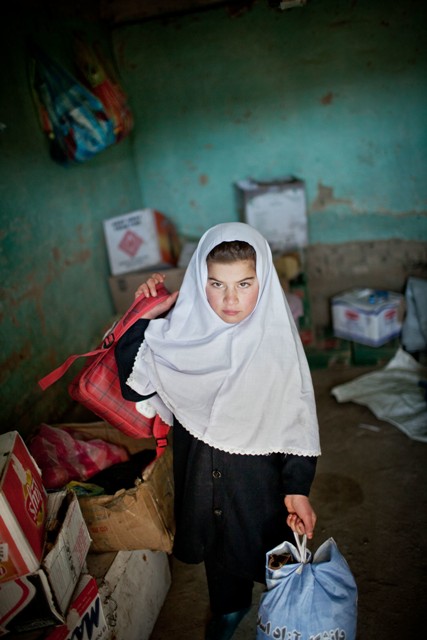 Tamana Mirwais, 10 years, changing every day before or after school (depending on whether she has lesson in the morning or in the afternoon) from girl clothes to boys&apos; wear, or viceversa, in a store near her girls&apos; school.