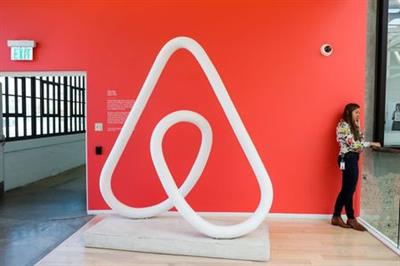 A woman talks on the phone at the Airbnb office headquarters in the SOMA district of San Francisco, California, U.S., August 2, 2016. REUTERS/Gabrielle Lurie