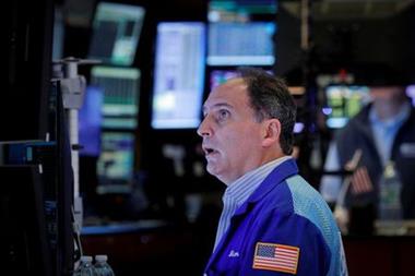 A trader works on the floor of the New York Stock Exchange (NYSE) in New York City, U.S., October 13, 2021. REUTERS/Brendan McDermid 