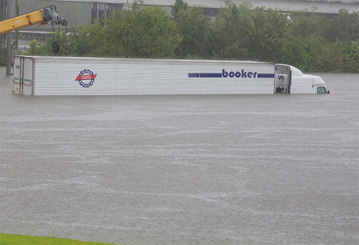 An Eighteen Wheel Tractor Trailer Is Stranded On Interstate Highway 45 Which Is Submerged From The Effects Of Hurricane Harvey Seen During Widespread Flooding In Houston, Texas