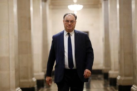 Bank of England Governor Andrew Bailey poses for a photograph on the first day of his new role at the Central Bank in London, Britain March 16, 2020. Tolga Akmen/Pool via REUTERS