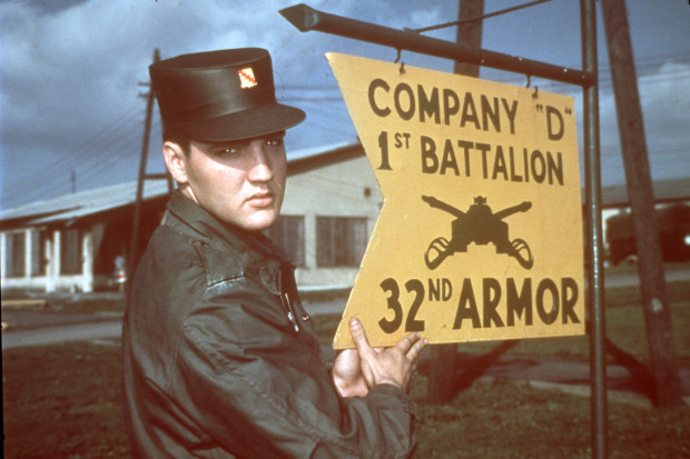 Elvis Presley is shown in uniform at company D 1st Battalion 32nd U.S. Army Armour at the barracks area in Friedberg, Germany, 1958. (AP Photo)