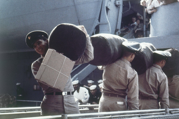 Elvis Presley boards a U.S. transport ship bound for service with the U.S. Armed Forces in Germany, 1958. Also wearing army uniform at company D 1st. Battalion 32nd Armory at the barracks, Friedberg, Germany. (AP Photo)