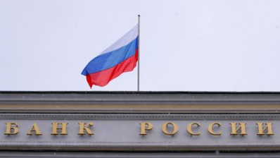 A Russian flag flies over Russian Central Bank headquarters in Moscow, Russia December 3, 2018. REUTERS/Maxim Shemetov