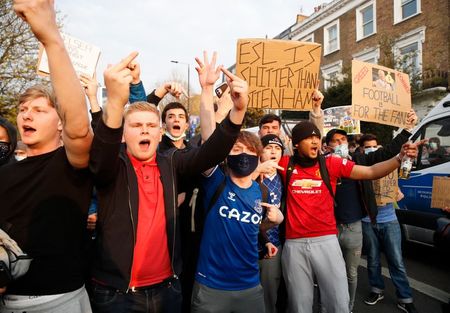 Soccer Football - Premier League - Chelsea v Brighton & Hove Albion - Stamford Bridge, London, Britain - April 20, 2021 Chelsea fans protest the planned European Super League outside the stadium before the match. It was announced twelve of Europe's top football clubs will launch a breakaway REUTERS/Matthew Childs