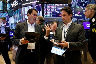 Traders work on the floor of the New York Stock Exchange (NYSE) in New York City, U.S., October 12, 2021. REUTERS/Brendan McDermid
