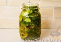 Фото к рецепту: Быстрые маринованные огурцы кружочками
