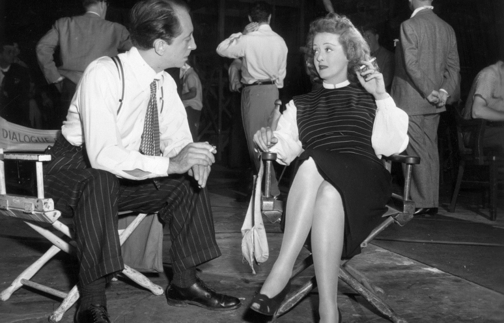 John Abbott and Bette Davis on the set of Deception directed by Irving Rapper, 1946.jpeg
