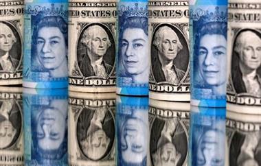 Pound and U.S. dollar bills are seen in this illustration taken January 6, 2020. REUTERS/Dado Ruvic/Illustration 