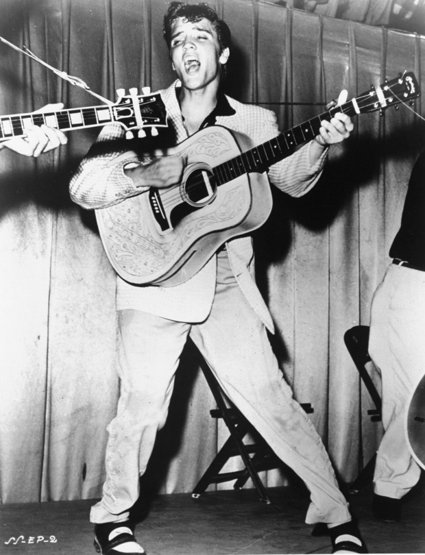This is a 1956 photo of Elvis Presley performing. This photo was used for his first RCA Victor album cover. (AP Photo)