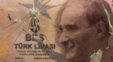 Turkish lira banknote is seen through broken glass in this illustration taken June 25, 2021. REUTERS/Dado Ruvic/Illustration 