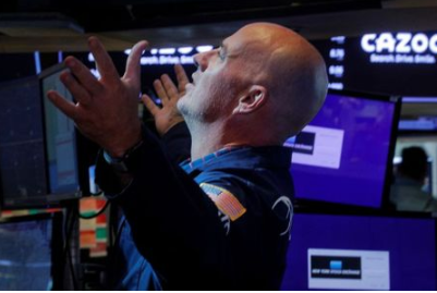 A trader works inside a post on the floor of the New York Stock Exchange (NYSE) in New York City, U.S., August 27, 2021. REUTERS/Brendan McDermid