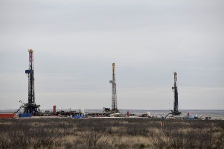 Drilling rigs operate in the Permian Basin oil and natural gas production area in Lea County, New Mexico, U.S., February 10, 2019. Picture taken February 10, 2019. REUTERS/Nick Oxford