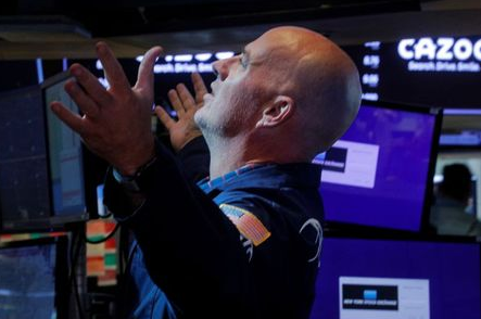 A trader works inside a post on the floor of the New York Stock Exchange (NYSE) in New York City, U.S., August 27, 2021. REUTERS/Brendan McDermid
