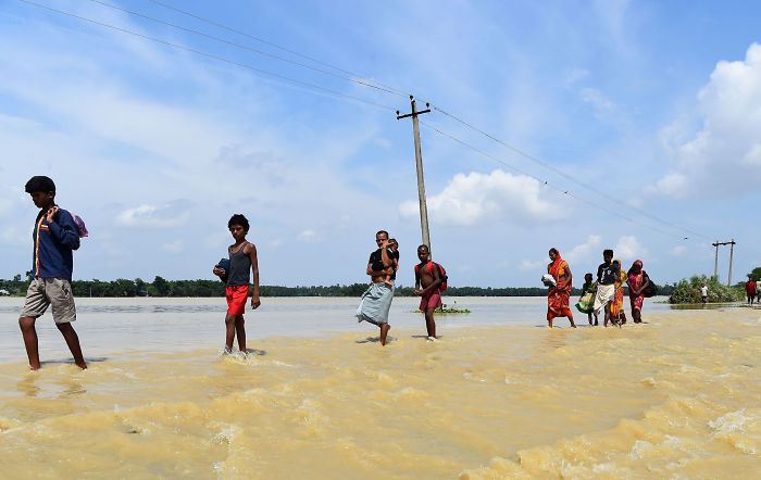 Crossing Through Flood Water In Tilathi, Nepal