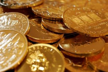 FILE PHOTO: Gold coins are displayed at the Ginza Tanaka store in Tokyo September 18, 2008. REUTERS/Yuriko Nakao/