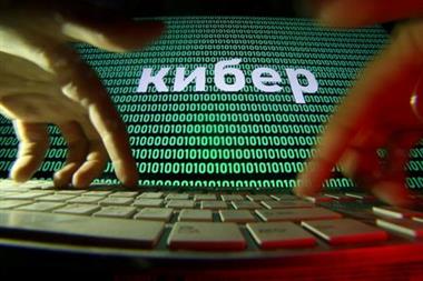 FILE PHOTO: Hands are seen on a keyboard in front of a displayed cyber code in this picture illustration taken October 4, 2018. REUTERS/Dado Ruvic/Illutration/File Photo