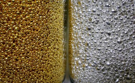 FILE PHOTO: Granules of 99.99 percent pure gold and silver are seen in glass jars at the Krastsvetmet non-ferrous metals plant, one of the world's largest producers in the precious metals industry, in the Siberian city of Krasnoyarsk, Russia November 22, 2018. REUTERS/Ilya Naymushin