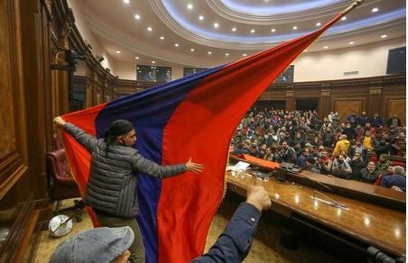 People storm the parliament, after Armenian Prime Minister Nikol Pashinyan said he had signed an agreement with leaders of Russia and Azerbaijan to end the war on Tuesday, in Yerevan, Armenia November 10, 2020. Vahram Baghdasaryan/Photolure via REUTERS ATTENTION EDITORS - THIS IMAGE HAS BEEN SUPPLIED BY A THIRD PARTY.