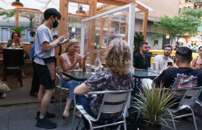 Guests enjoy outdoor dining in the Manhattan borough of New York City, U.S., May 23, 2021. REUTERS/Caitlin Ochs