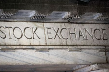 Stock Exchange is seen over an entrance to the New York Stock Exchange (NYSE) on Wall St. in New York City, U.S., March 29, 2021. REUTERS/Brendan McDermid