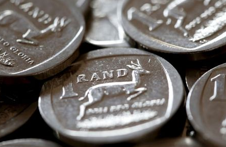 South African Rand coins are seen in this photo illustration taken September 9, 2015. South Africa's rand recovered some ground on Monday after falling 4 percent on Friday due to a row involving the finance minister, but government bonds fell. REUTERS/Mike Hutchings