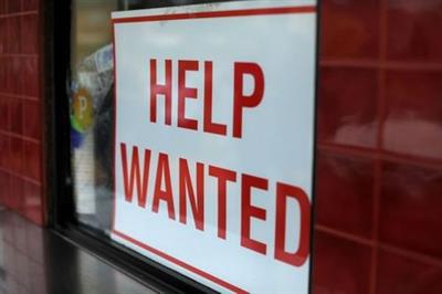 A help wanted sign is posted at a taco stand in Solana Beach, California, U.S., July 17, 2017. REUTERS/Mike Blake