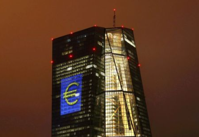 The headquarters of the European Central Bank (ECB) are illuminated with a giant euro sign at the start of the "Luminale, light and building" event in Frankfurt, Germany, March 12, 2016. EUTERS/Kai Pfaffenbach/File Photo