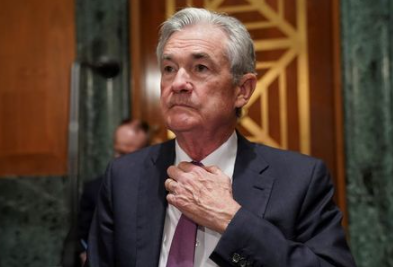 Federal Reserve Chair Jerome Powell adjusts his tie as he arrives to testify before a Senate Banking, Housing and Urban Affairs Committee hearing on “The Semiannual Monetary Policy Report to the Congress” on Capitol Hill in Washington, U.S., July 15, 2021. REUTERS/Kevin Lamarque