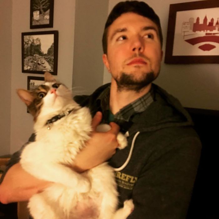 Man Cuddles Cats On Instagram