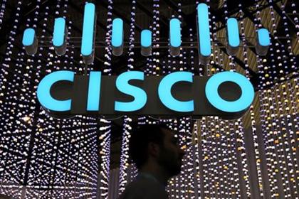 A man passes under a Cisco logo at the Mobile World Congress in Barcelona, Spain February 25, 2019. REUTERS/Sergio Perez 
