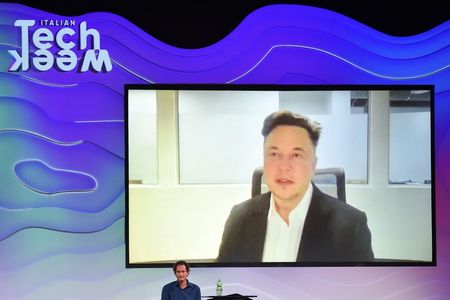 Chairman of Stellantis and Ferrari John Elkann speaks via video conference with Tesla's founder Elon Musk during the "Italian Tech Week" event in Turin, Italy September 24, 2021. REUTERS/Massimo Pinca