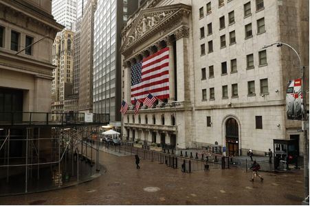 FILE PHOTO: S&P500 index United States flags fly outside of the New York Stock Exchange (NYSE) as markets continue to react to the coronavirus disease (COVID-19) at the NYSE in New York, U.S., March 19, 2020. REUTERS/Lucas Jackson