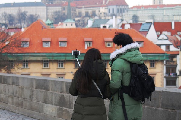 man-and-woman-using-a-selfie-stick.jpg
