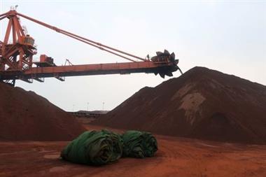 A machine works on blending the iron ore at Dalian Port, Liaoning province, China September 21, 2018. Picture taken September 21, 2018. REUTERS/Muyu Xu 