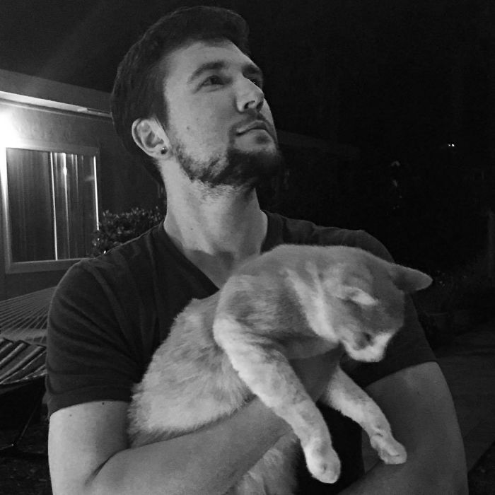 Man Cuddles Cats On Instagram