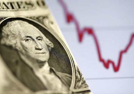 FILE PHOTO: A U.S. dollar note is seen in front of a stock graph in this November 7, 2016 picture illustration. REUTERS/Dado Ruvic/Illustration/File Photo