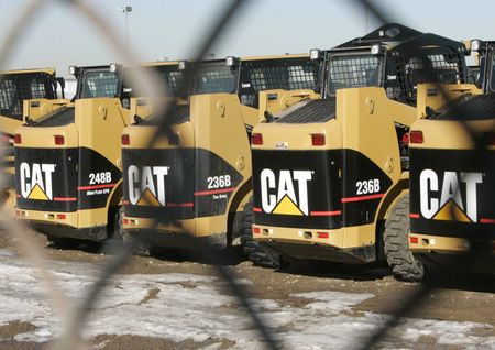 A line of Caterpillar skid steers are seen at a dealer in Denver, Colorado January 26, 2007. Caterpillar Inc. said on Friday its net quarterly profit rose 4.3 percent, helped by increased sales of engines and other machinery, and it stuck by its full year forecast, sending its shares higher. REUTERS/Rick Wilking (UNITED STATES) 