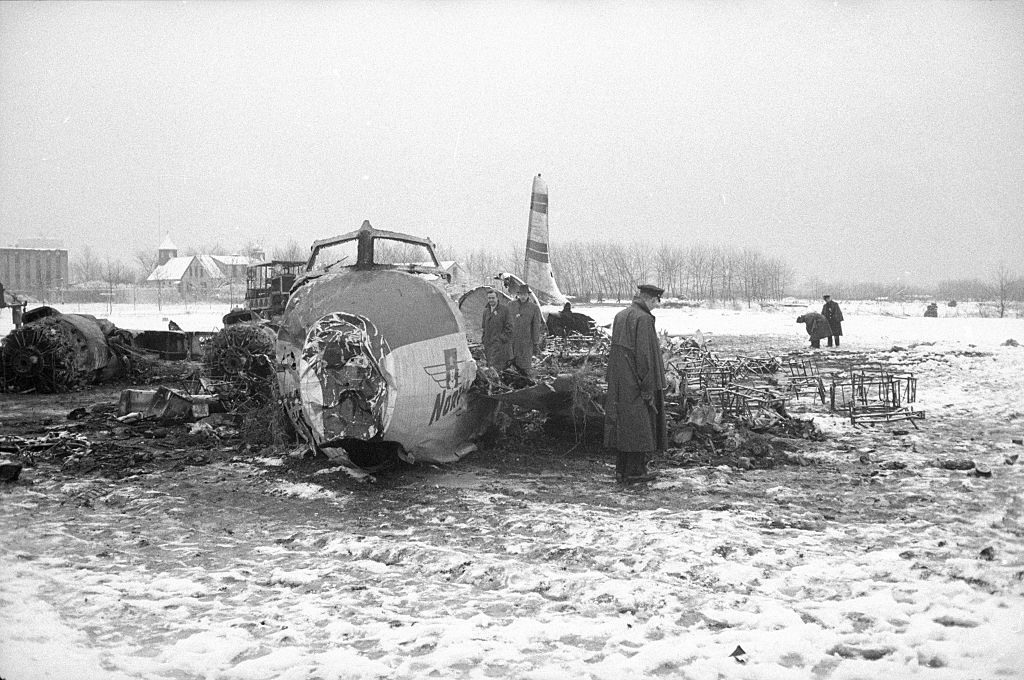 Police searching wreckage after Northeast Airlines Flight 823 on Rikers Island, February 1957.