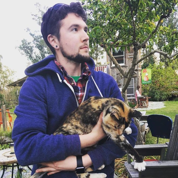 Man Cuddles Cats On Instagram