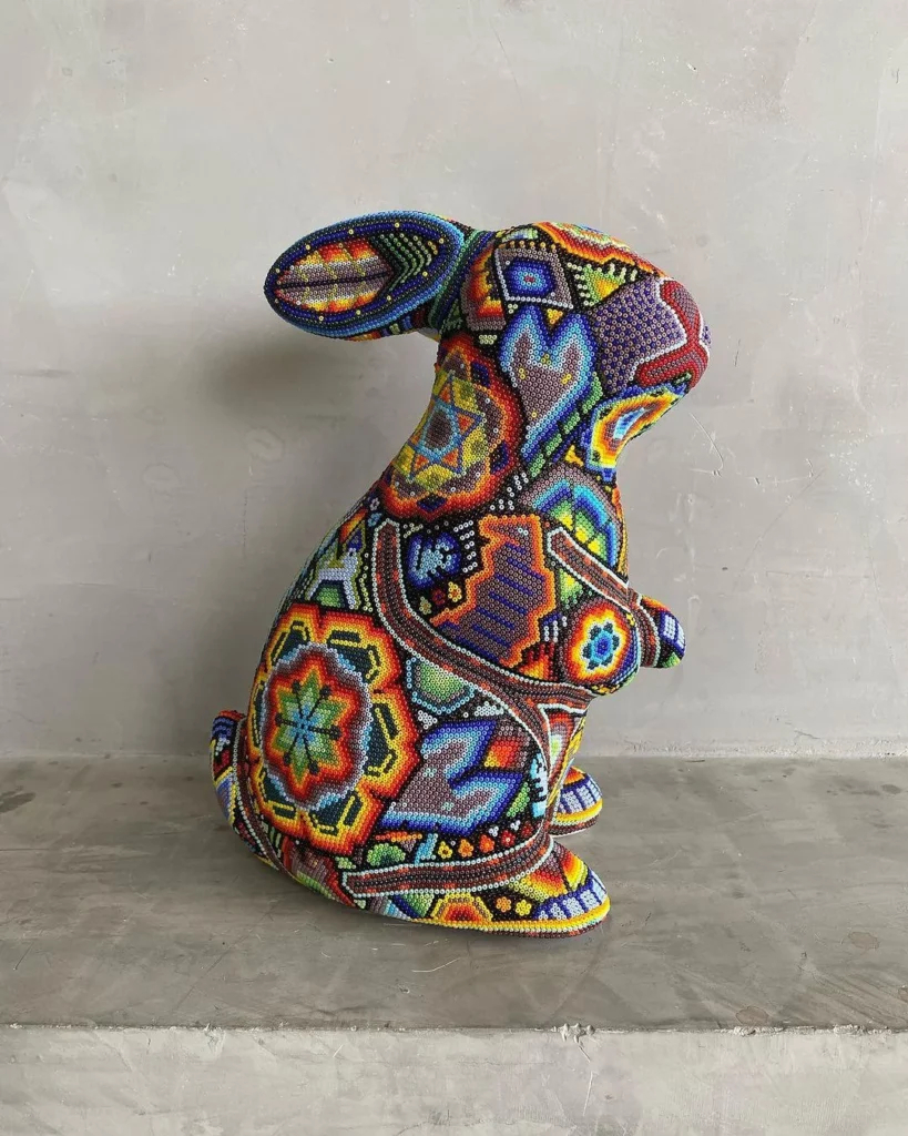 Made this rabbit sculpture carved in wood and decorated v0 gly7wyjzubzb1