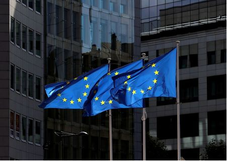 European Union flags flutter outside the European Commission headquarters in Brussels, Belgium August 21, 2020. REUTERS/Yves Herman