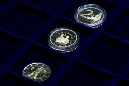 A 2 euro coin commemorating the role of health workers during the coronavirus disease (COVID-19) pandemic is displayed at the Italian Mint, in Rome, Italy, January 21, 2021. REUTERS/Guglielmo Mangiapane