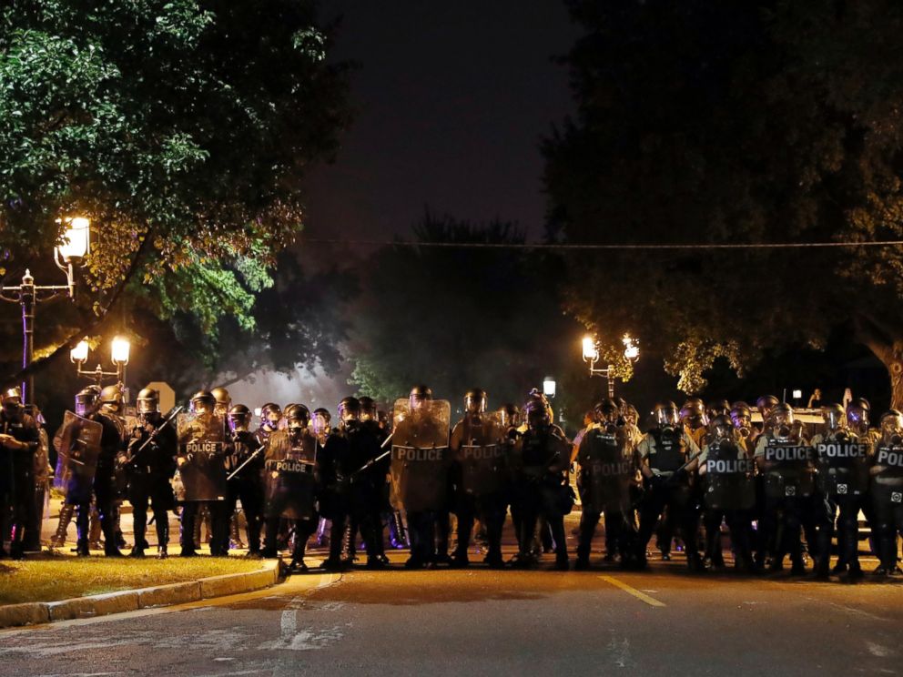 Police line up as protesters gather, Friday, Sept. 15, 2017, in St. Louis, after a judge found a white former St. Louis police officer, Jason Stockley, not guilty of first-degree murder in the death of a black man, Anthony Lamar Smith, who was fatall