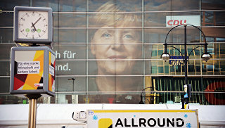 Плакат с изображением канцлера Германии, лидера ХДС Ангелы Меркель. Архивное фото