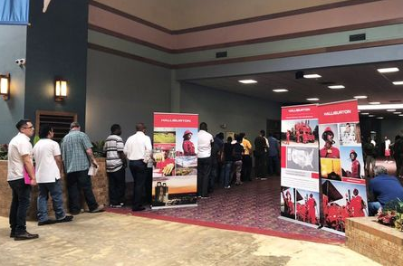 Job seekers line up at a job fair of an oil services giant Halliburton at the MCM Grande Fundome hotel in Odessa, Texas, U.S., July 19, 2018. Picture taken on July 19, 2018. REUTERS/Liz Hampton