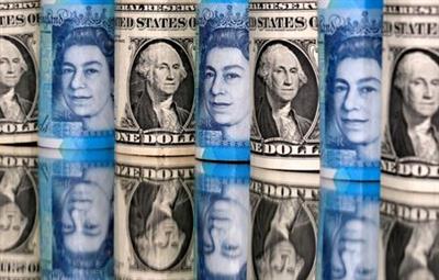 Pound and U.S. dollar bills are seen in this illustration taken January 6, 2020. REUTERS/Dado Ruvic/Illustration