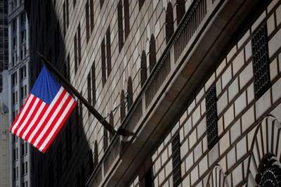 A U.S. flag flies outside The Federal Reserve Bank of New York in New York City, U.S., March 29, 2021. REUTERS/Brendan McDermid