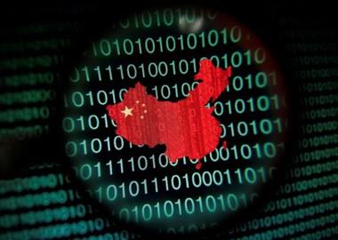 FILE PHOTO: A map of China is seen through a magnifying glass on a computer screen showing binary digits in Singapore in this January 2, 2014 photo illustration. Picture taken January 2, 2014. REUTERS/Edgar Su/File Photo 