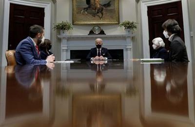 FILE PHOTO: U.S. President Joe Biden is flanked by Vice President Kamala Harris and Treasury Secretary Janet Yellen as Brian Deese, director of the White House National Economic Council, and Cecilia Rouse, chair of the Council of Economic Advisers, participate in an economic briefing in the Roosevelt Room at the White House in Washington, U.S., March 5, 2021. REUTERS/Tom Brenner/File Photo